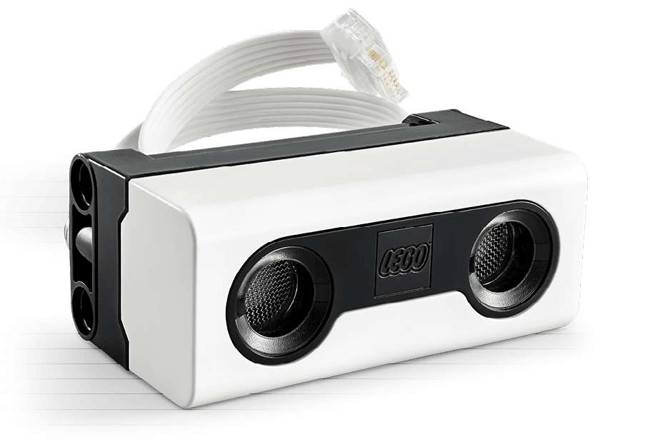 A white and black speaker with a white cord. Description generated by AI