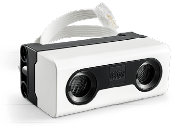 A white and black speaker with a white cord. Description generated by AI